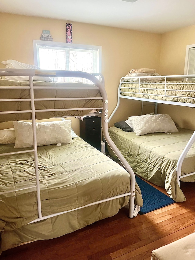 bedroom with wood finished floors