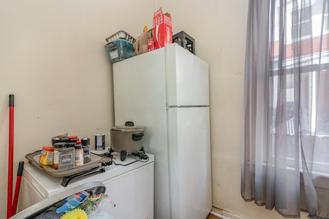 kitchen featuring freestanding refrigerator