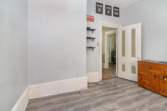 spare room featuring wood finished floors