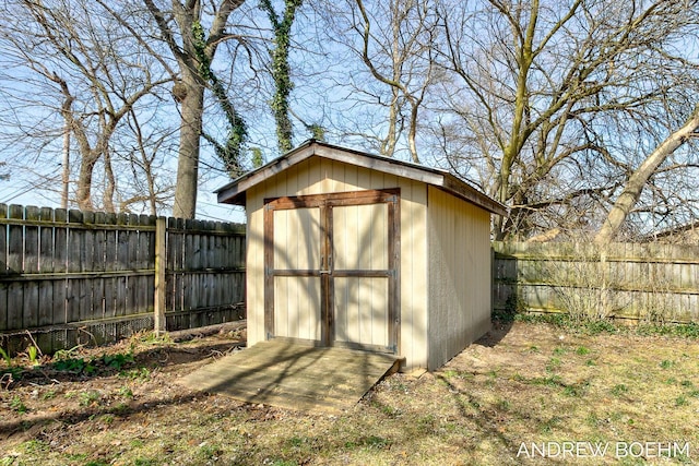 view of shed with a fenced backyard