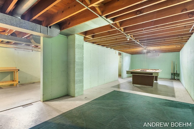 unfinished basement with pool table