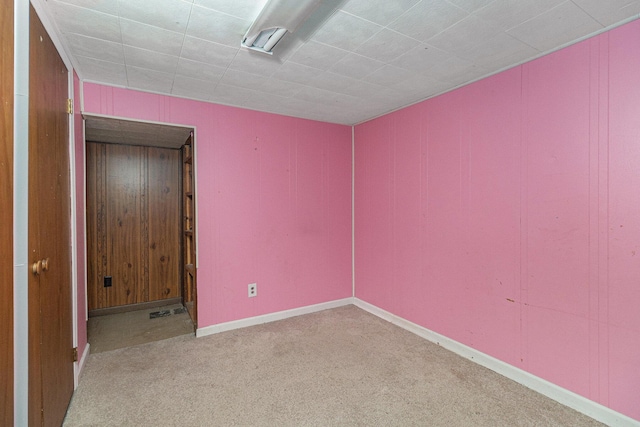 unfurnished bedroom with baseboards and carpet floors