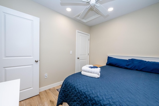 bedroom featuring recessed lighting, baseboards, light wood finished floors, and ceiling fan