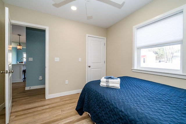 bedroom with recessed lighting, baseboards, light wood-type flooring, and ceiling fan