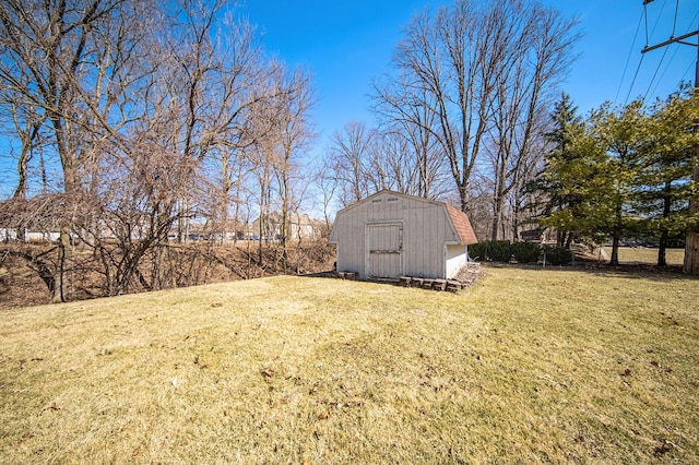 view of yard featuring a storage shed and an outbuilding