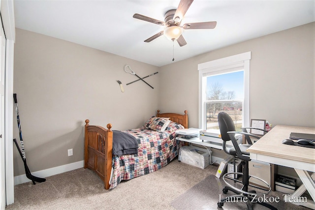 carpeted bedroom featuring ceiling fan and baseboards