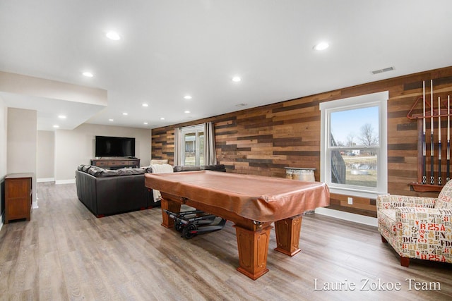 playroom featuring light wood finished floors, visible vents, recessed lighting, and wooden walls