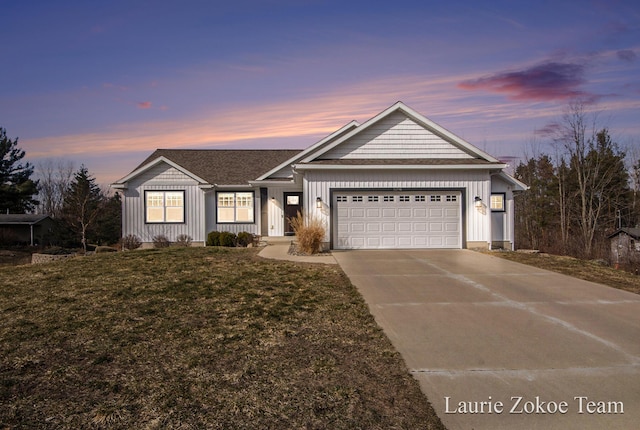 ranch-style house with a front yard, driveway, roof with shingles, an attached garage, and board and batten siding