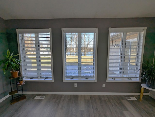 674 Booth Rd, Bronson, MI 49028 - interior space featuring visible vents, baseboards, and wood finished floors