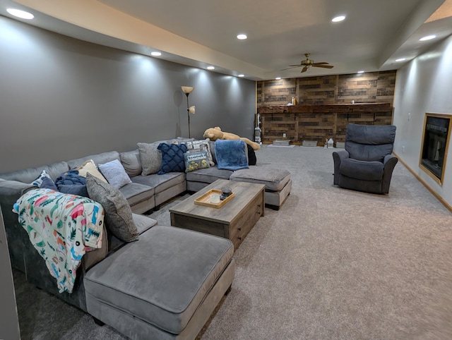 674 Booth Rd, Bronson, MI 49028 - carpeted living room featuring recessed lighting, wooden walls, an accent wall, and a ceiling fan