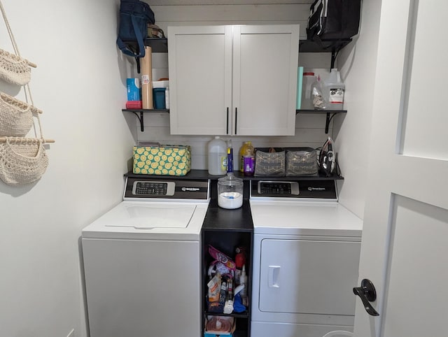 674 Booth Rd, Bronson, MI 49028 - laundry room featuring independent washer and dryer and cabinet space