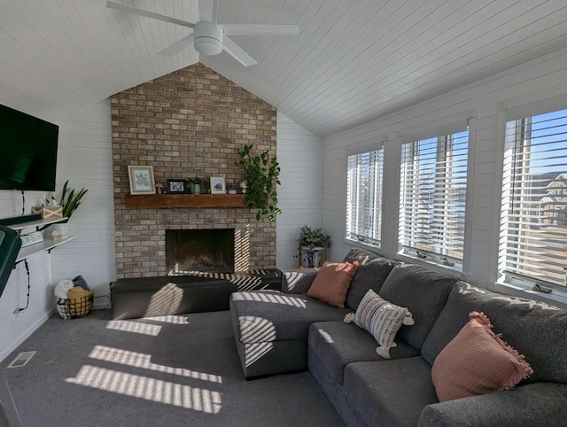 674 Booth Rd, Bronson, MI 49028 - living room with a brick fireplace, a ceiling fan, vaulted ceiling, and a wealth of natural light