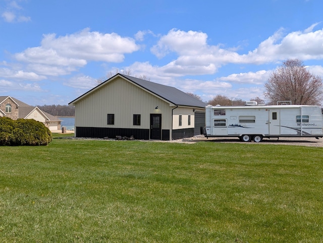 674 Booth Rd, Bronson, MI 49028 - view of property exterior featuring a lawn