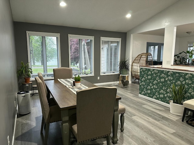 674 Booth Rd, Bronson, MI 49028 - dining area with baseboards, wood finished floors, vaulted ceiling, and recessed lighting