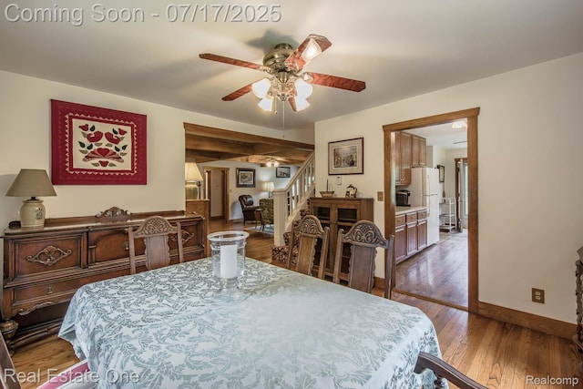 727 Romeo Rd, Rochester, MI 48307 - dining room with stairway, a ceiling fan, and wood finished floors