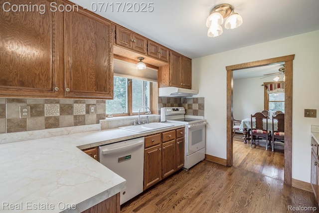 727 Romeo Rd, Rochester, MI 48307 - kitchen featuring plenty of natural light, white appliances, decorative backsplash, and dark wood-style flooring
