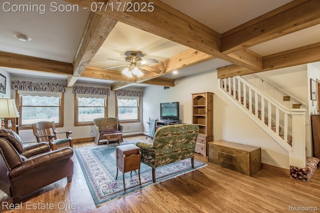 727 Romeo Rd, Rochester, MI 48307 - living area with wood finished floors, plenty of natural light, stairs, beam ceiling, and a ceiling fan