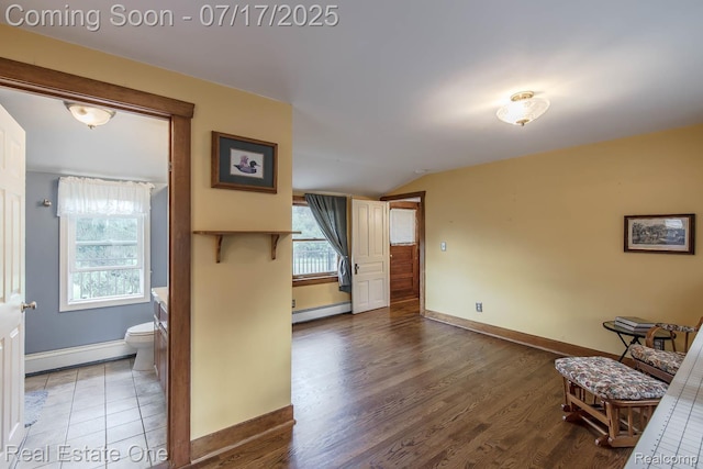 727 Romeo Rd, Rochester, MI 48307 - hallway featuring lofted ceiling, a baseboard radiator, and wood finished floors