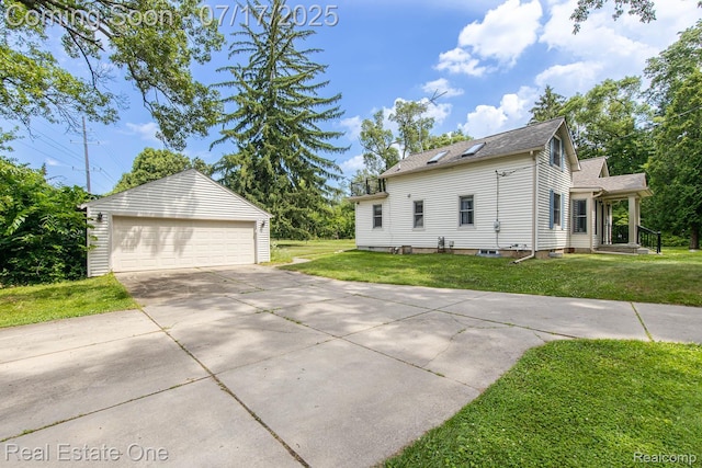 727 Romeo Rd, Rochester, MI 48307 - view of side of property with an outbuilding, a garage, a lawn, and a shingled roof