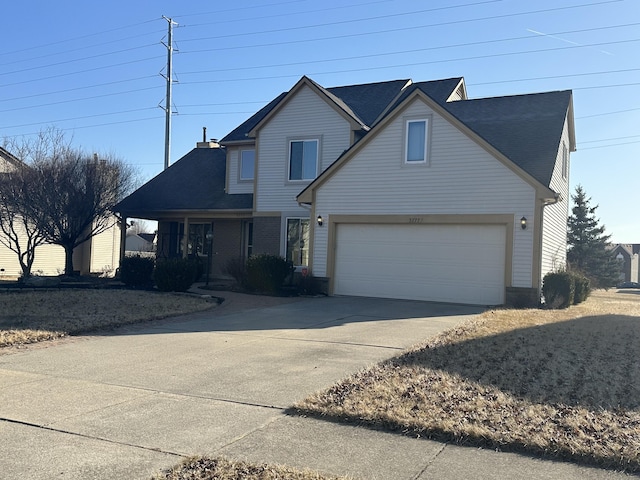 traditional home featuring driveway and a garage