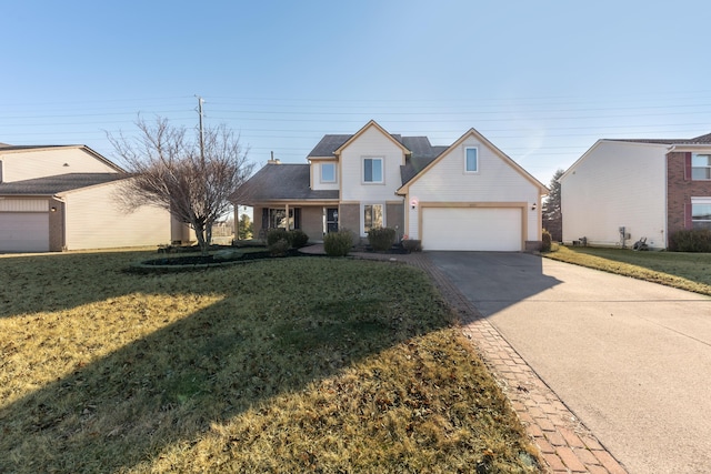 view of front of house featuring a garage, concrete driveway, and a front lawn