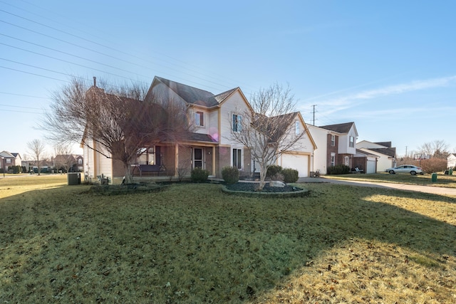traditional-style home featuring a residential view, an attached garage, concrete driveway, and a front yard