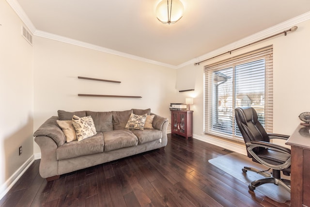office space with crown molding, hardwood / wood-style flooring, baseboards, and visible vents