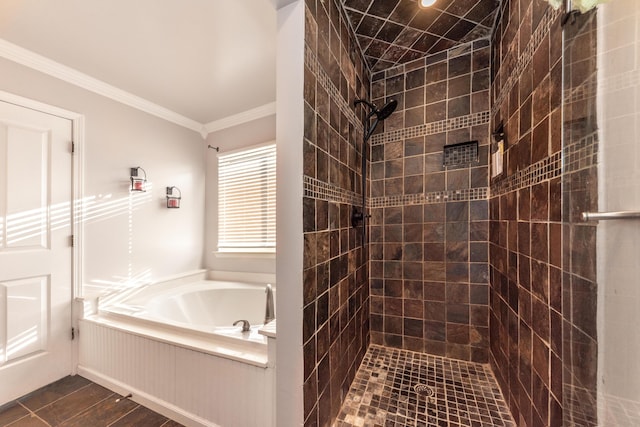 full bath featuring a garden tub, ornamental molding, and a tile shower
