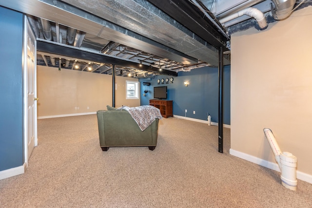 basement featuring baseboards and carpet