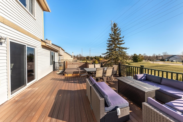 wooden terrace featuring outdoor lounge area and outdoor dining area