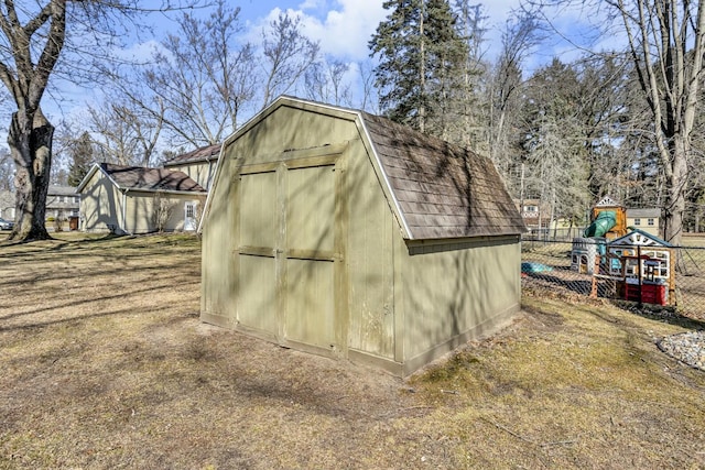 view of shed with fence