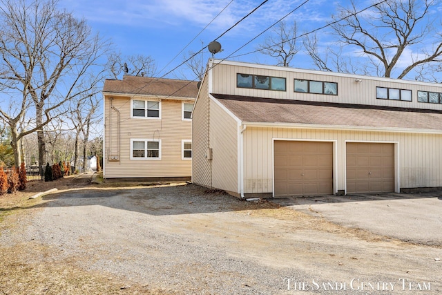 view of property exterior featuring a shingled roof