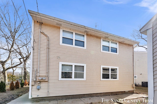 rear view of house with central AC