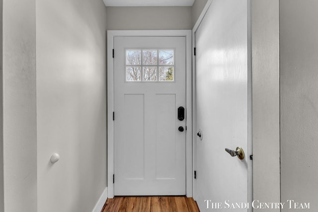 entryway with wood finished floors