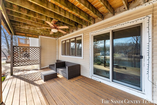 deck featuring an outdoor living space and ceiling fan