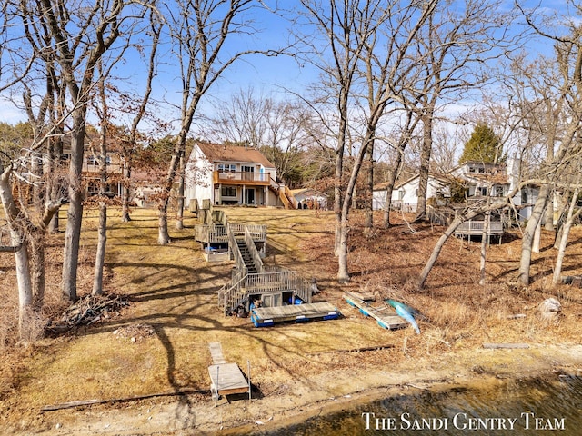 view of yard with stairs and a deck