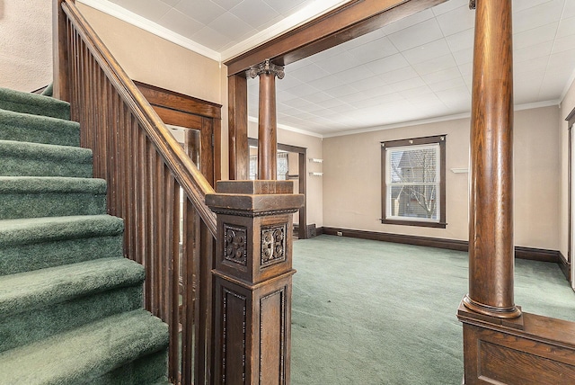 stairway featuring baseboards, carpet floors, and ornamental molding