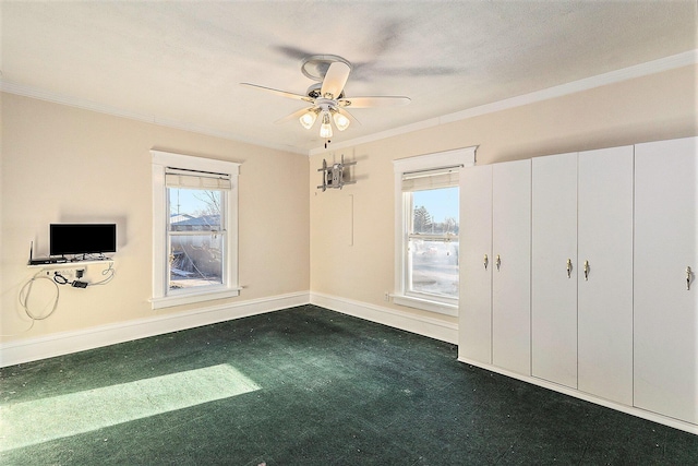 unfurnished bedroom with ceiling fan, crown molding, baseboards, and a textured ceiling