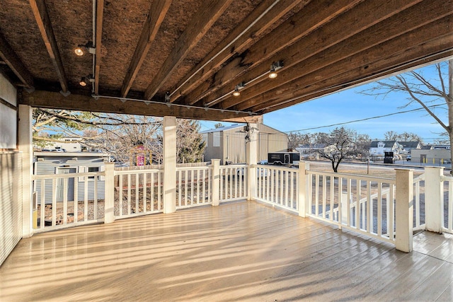 deck with an outbuilding and a storage shed