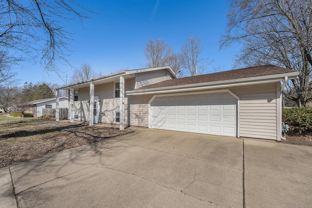 view of front of home featuring driveway and a garage