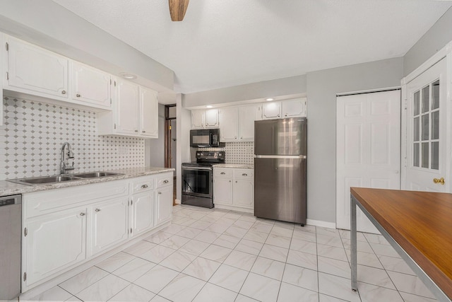 kitchen featuring a sink, white cabinetry, and stainless steel appliances