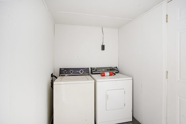 washroom featuring laundry area and washer and clothes dryer