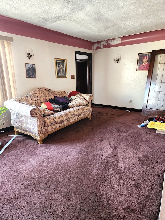 carpeted living room with baseboards and a textured ceiling