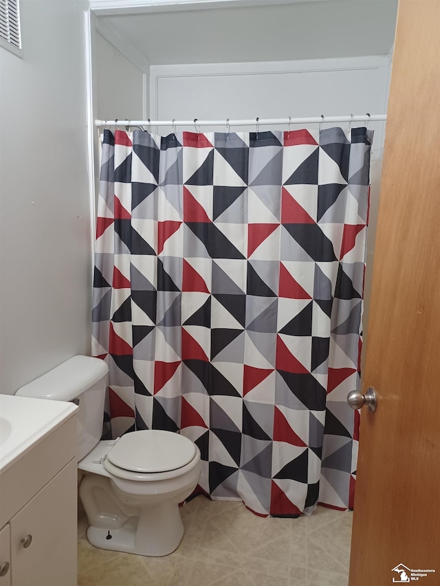 bathroom with visible vents, curtained shower, toilet, tile patterned floors, and vanity