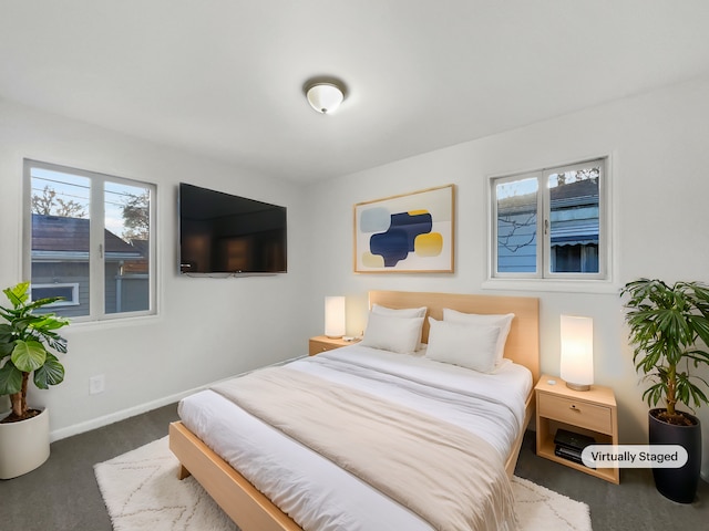 carpeted bedroom with baseboards