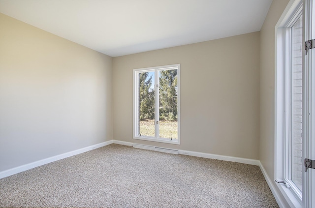 carpeted empty room featuring visible vents and baseboards