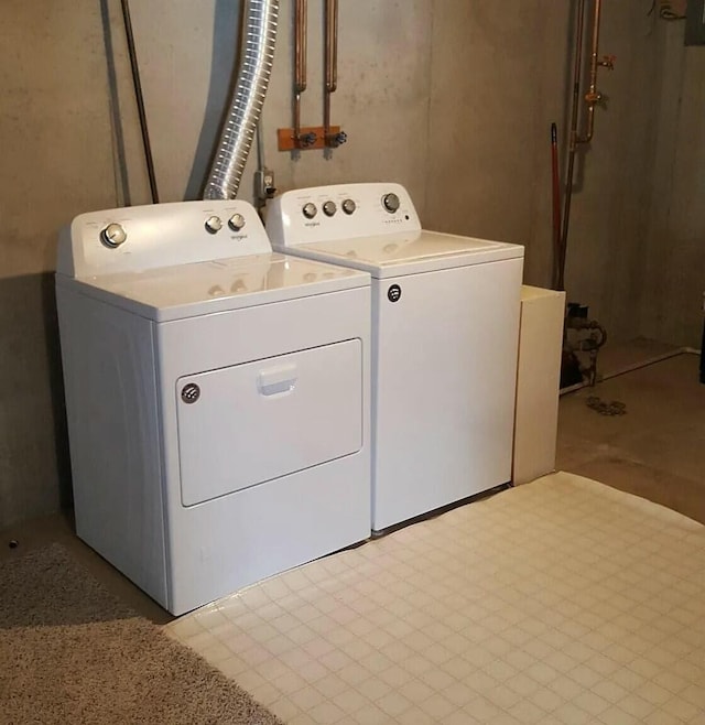 laundry area featuring washing machine and dryer and laundry area