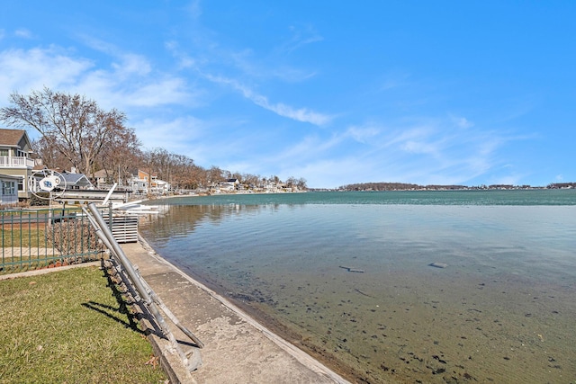 property view of water featuring fence