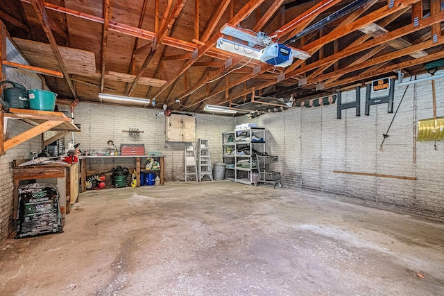 garage featuring a workshop area and a garage door opener