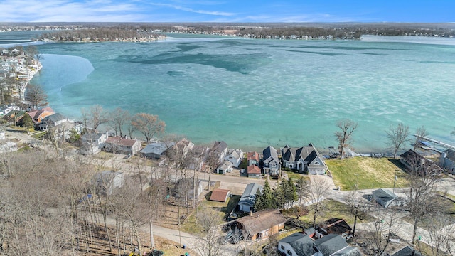 bird's eye view with a residential view and a water view